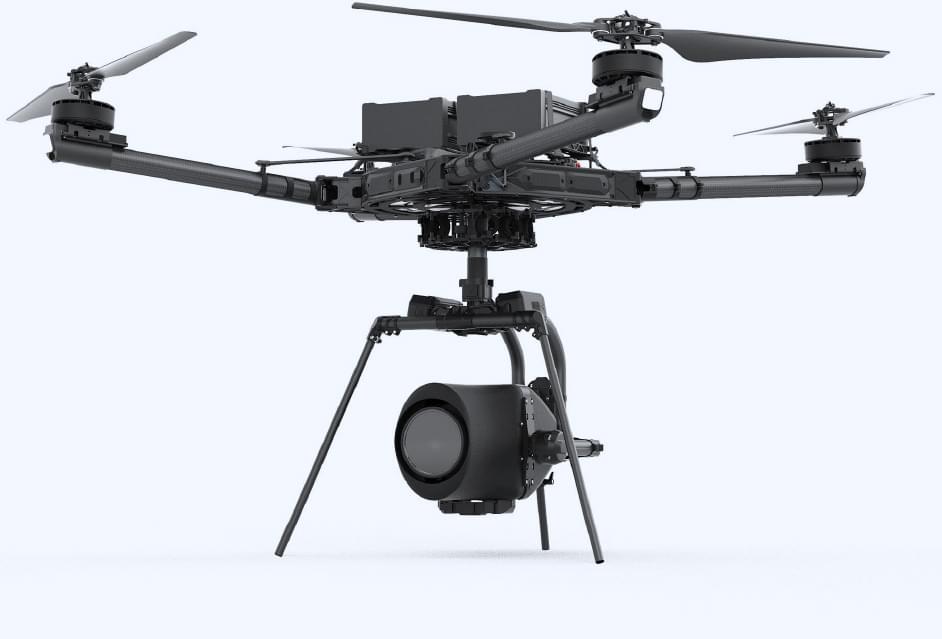 Professional heavy-lift cinematography drone equipped with a large stabilized camera gimbal system on a white background.